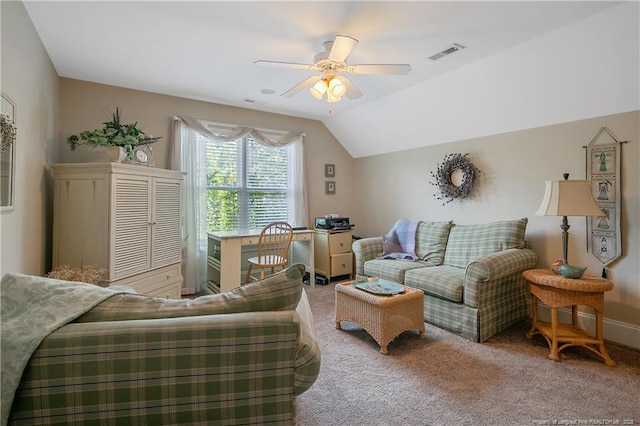 carpeted living area featuring ceiling fan, a desk, and vaulted ceiling