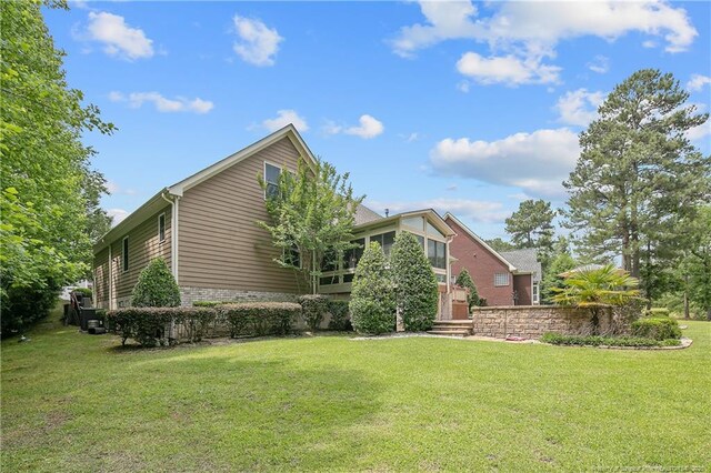 42 Skipping Water Dr, Spring Lake, NC 28390 - view of side of property with a lawn