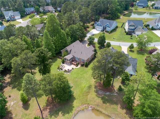 aerial perspective of suburban area featuring a large body of water