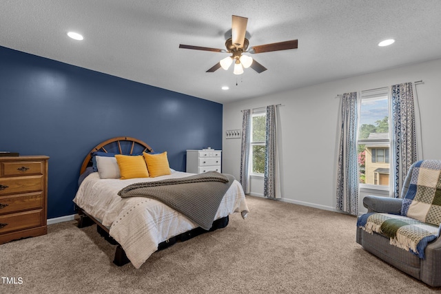 carpeted bedroom with recessed lighting, baseboards, a textured ceiling, and ceiling fan