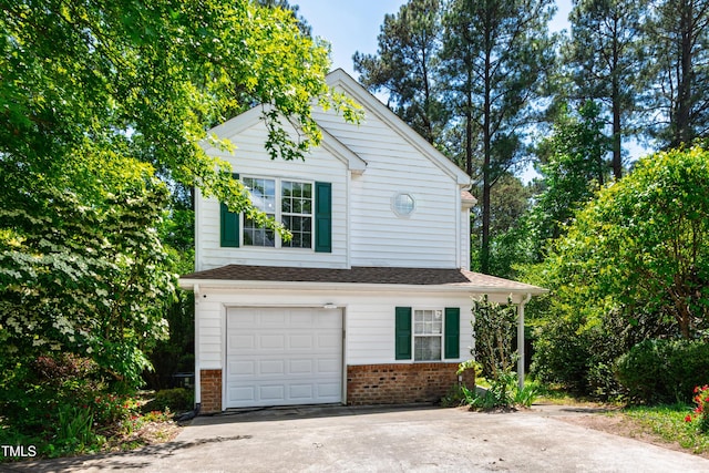 garage with concrete driveway