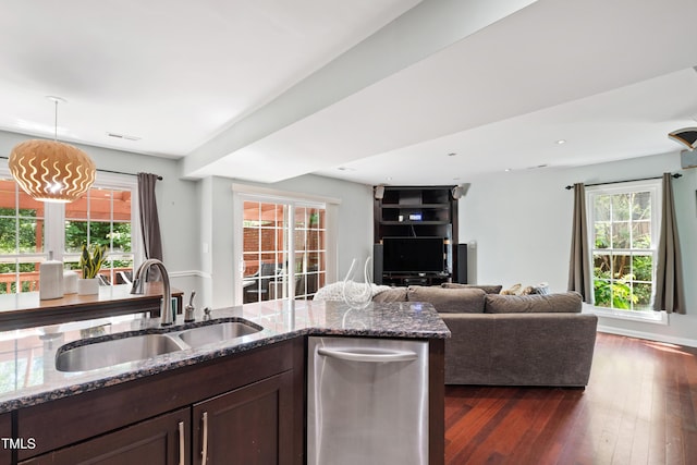 kitchen featuring a sink, dark brown cabinetry, stone countertops, dark wood-type flooring, and recessed lighting