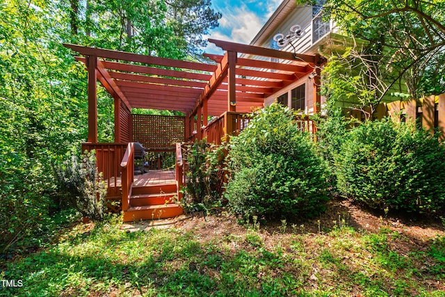 view of yard with a pergola and a wooden deck