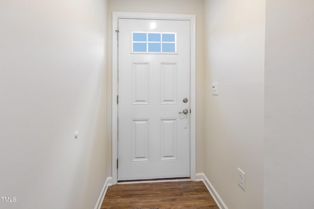 entryway with dark wood-style floors and baseboards
