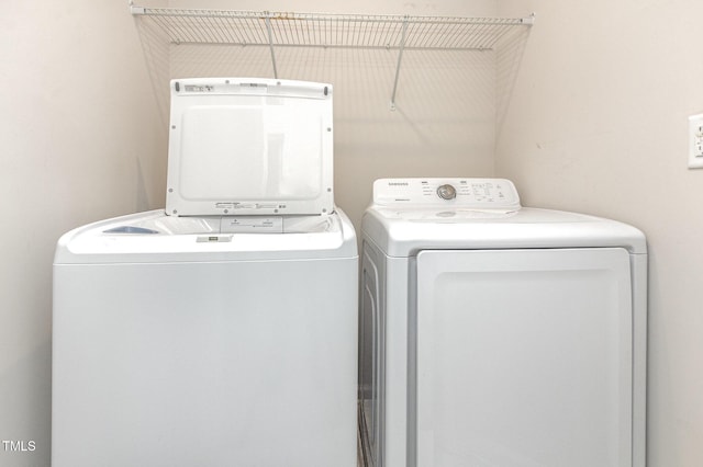 washroom with washer and dryer
