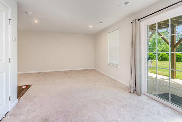 unfurnished room featuring light carpet, baseboards, and recessed lighting