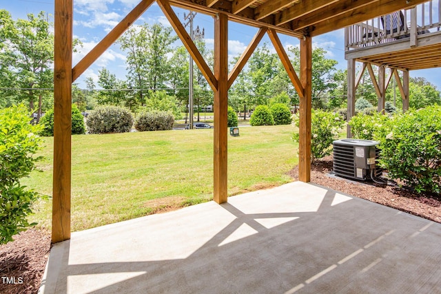 view of patio / terrace featuring central AC and view of scattered trees