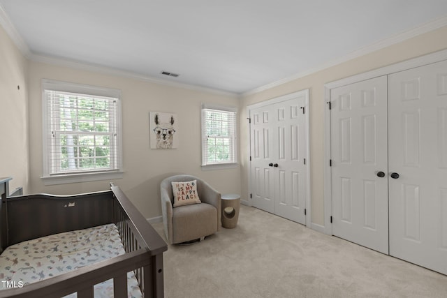 18 Acornridge Ct, Durham, NC 27707 - carpeted bedroom with two closets, multiple windows, ornamental molding, and baseboards