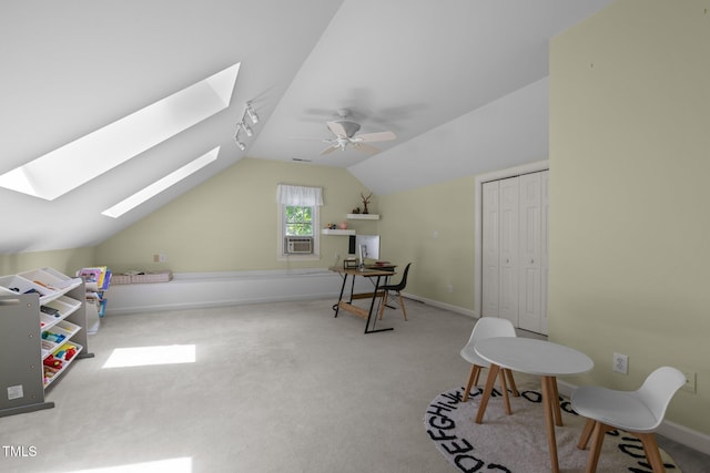 18 Acornridge Ct, Durham, NC 27707 - rec room featuring a skylight, vaulted ceiling, carpet floors, a ceiling fan, and baseboards