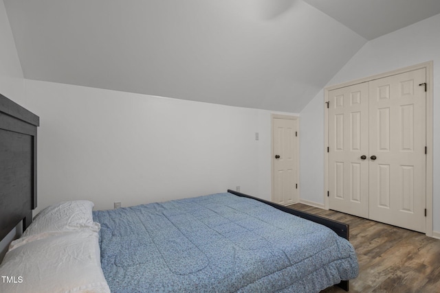 18 Acornridge Ct, Durham, NC 27707 - bedroom with lofted ceiling, wood finished floors, baseboards, and a closet