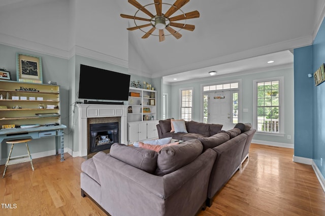 281 Derwin Dr, Timberlake, NC 27583 - living area with ceiling fan, ornamental molding, a glass covered fireplace, wood finished floors, and baseboards