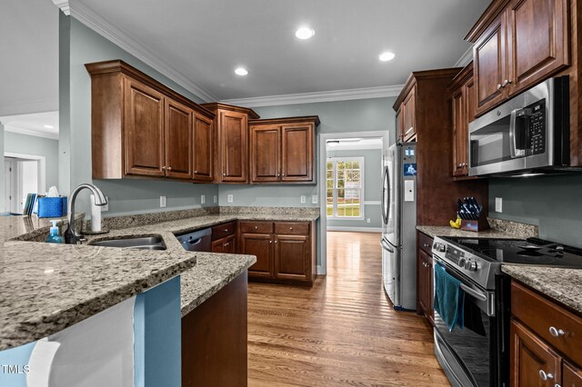 281 Derwin Dr, Timberlake, NC 27583 - kitchen with stainless steel appliances, a sink, crown molding, light wood-style flooring, and light stone counters