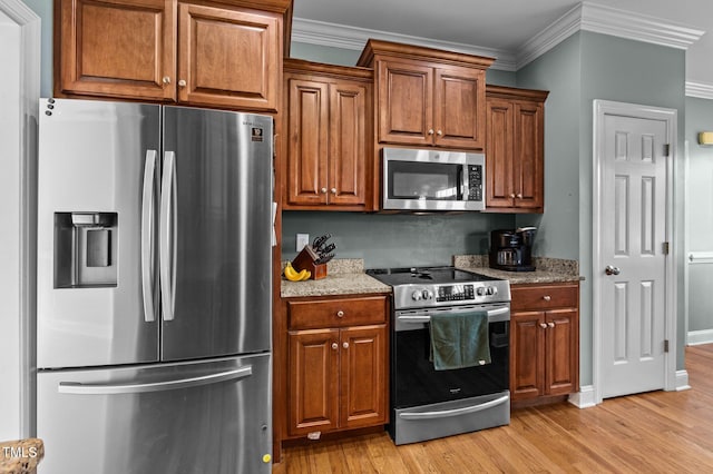 281 Derwin Dr, Timberlake, NC 27583 - kitchen featuring appliances with stainless steel finishes, light wood-style floors, crown molding, light stone counters, and brown cabinetry
