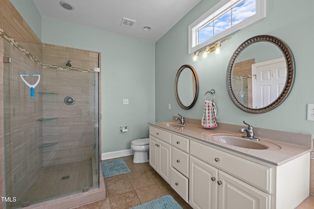 281 Derwin Dr, Timberlake, NC 27583 - bathroom with a shower stall, double vanity, toilet, baseboards, and tile patterned flooring
