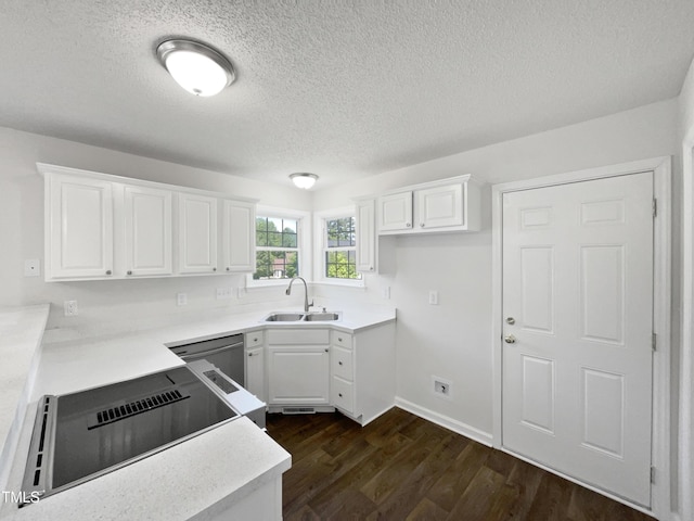3708 Mackinac Island Ln, Raleigh, NC 27610 - kitchen featuring a sink, dark wood-type flooring, a textured ceiling, and white cabinets