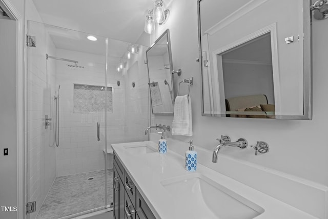 full bathroom with a shower stall, double vanity, and recessed lighting