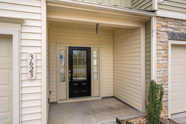 3623 Landshire View Ln, Raleigh, NC 27616 - property entrance with stone siding and a garage