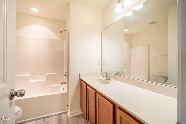 3623 Landshire View Ln, Raleigh, NC 27616 - bathroom with toilet, vanity, wood finished floors, bathing tub / shower combination, and baseboards