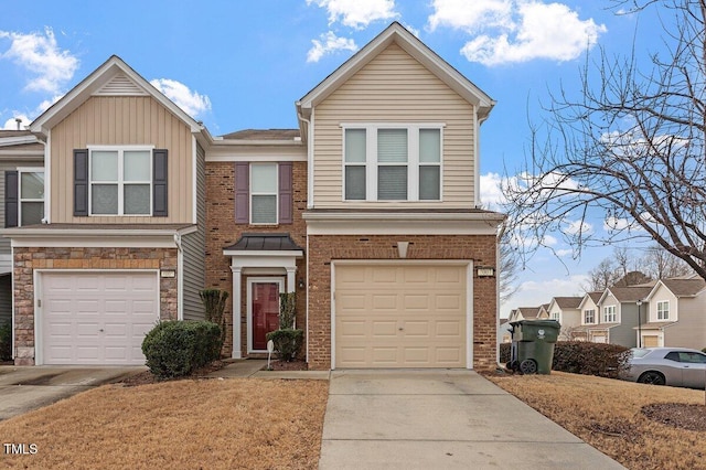 multi unit property featuring an attached garage, driveway, and brick siding