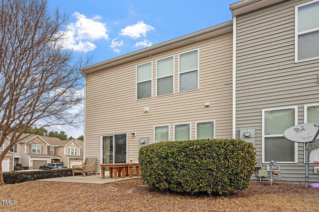 rear view of house featuring a patio