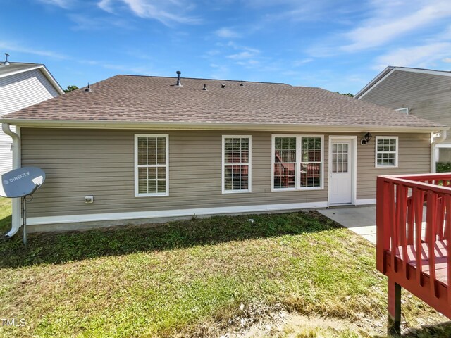 5612 Tealbrook Dr, Raleigh, NC 27610 - rear view of property with a yard, a shingled roof, and a wooden deck