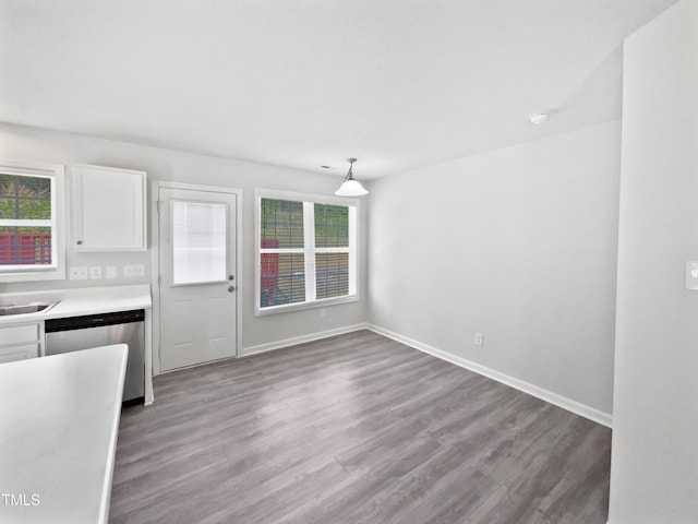5612 Tealbrook Dr, Raleigh, NC 27610 - unfurnished dining area featuring plenty of natural light, wood finished floors, and baseboards