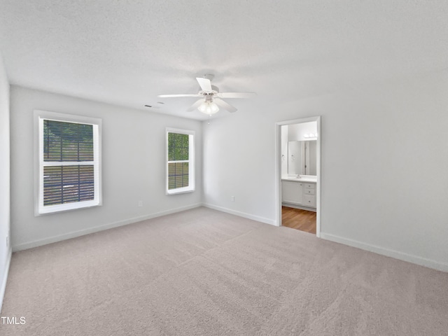5612 Tealbrook Dr, Raleigh, NC 27610 - unfurnished bedroom with carpet flooring, baseboards, connected bathroom, and a ceiling fan