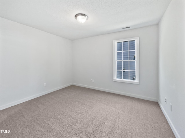 5612 Tealbrook Dr, Raleigh, NC 27610 - unfurnished room featuring carpet, baseboards, and a textured ceiling