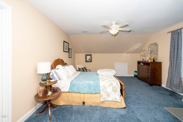 carpeted bedroom featuring lofted ceiling, baseboards, and ceiling fan
