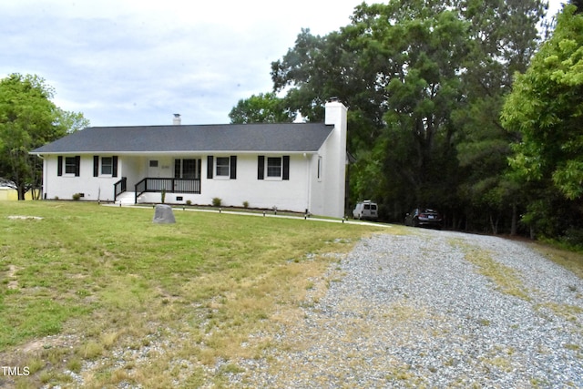 3141 Wagoner Ln Unit 09, Graham, NC 27253 - ranch-style house with gravel driveway, a chimney, and a front yard