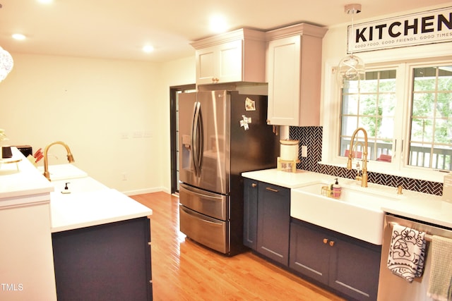 3141 Wagoner Ln Unit 09, Graham, NC 27253 - kitchen with a sink, stainless steel appliances, light wood finished floors, light countertops, and recessed lighting