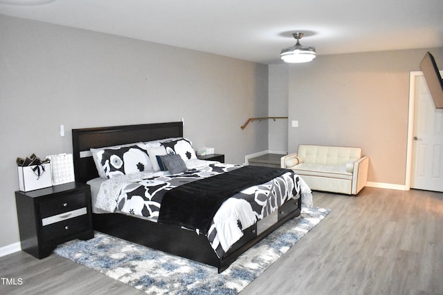 3141 Wagoner Ln Unit 09, Graham, NC 27253 - bedroom with wood finished floors and baseboards