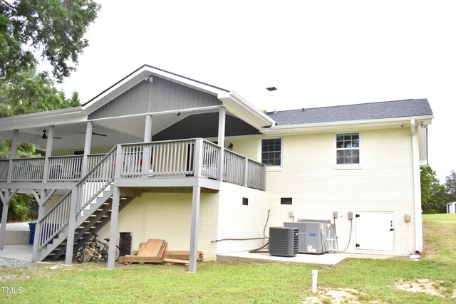 3141 Wagoner Ln Unit 09, Graham, NC 27253 - back of property featuring a lawn, brick siding, cooling unit, and stairway