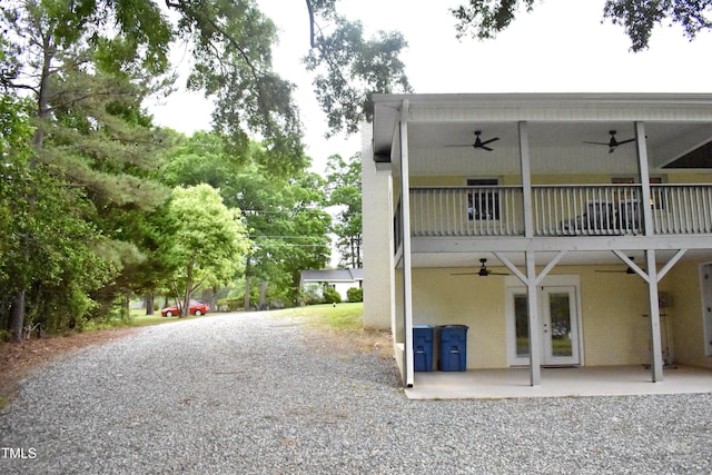 3141 Wagoner Ln Unit 09, Graham, NC 27253 - back of house featuring ceiling fan, a balcony, brick siding, and a patio area