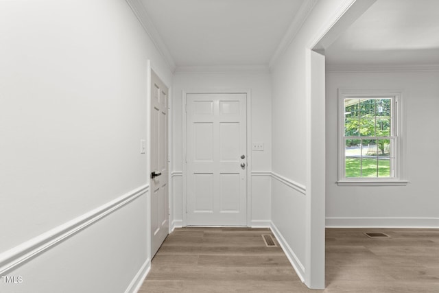 3204 Manor Ridge Dr, Raleigh, NC 27603 - hall featuring light wood finished floors, crown molding, and baseboards
