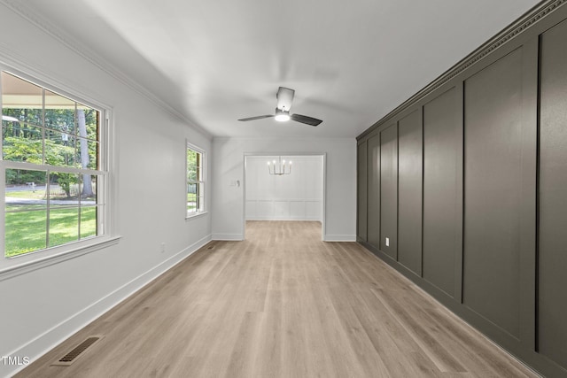 3204 Manor Ridge Dr, Raleigh, NC 27603 - unfurnished room featuring light wood-type flooring, baseboards, a ceiling fan, and a chandelier