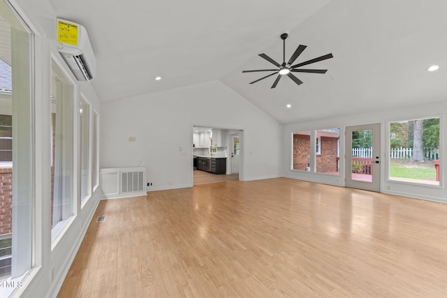 3204 Manor Ridge Dr, Raleigh, NC 27603 - unfurnished living room featuring a wall unit AC, a ceiling fan, light wood finished floors, recessed lighting, and high vaulted ceiling