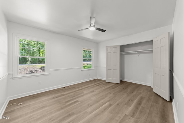 3204 Manor Ridge Dr, Raleigh, NC 27603 - unfurnished bedroom featuring wood finished floors, a closet, baseboards, and ceiling fan