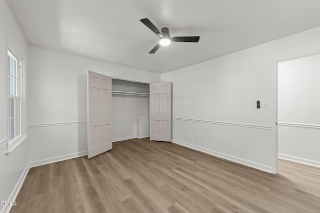 3204 Manor Ridge Dr, Raleigh, NC 27603 - unfurnished bedroom with light wood finished floors, a closet, a ceiling fan, and baseboards