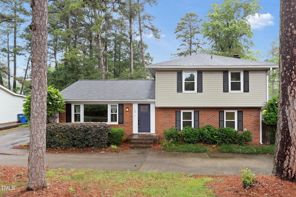 509 E Millbrook Rd, Raleigh, NC 27609 - split level home featuring brick siding