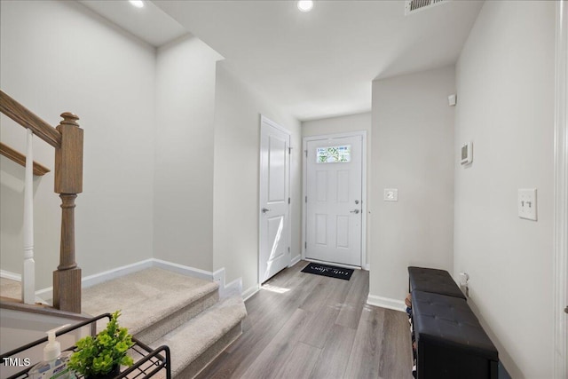 926 Romeria Dr, Durham, NC 27713 - entryway with stairs, wood finished floors, baseboards, and recessed lighting