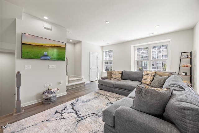 926 Romeria Dr, Durham, NC 27713 - living room with wood finished floors, stairs, baseboards, and recessed lighting