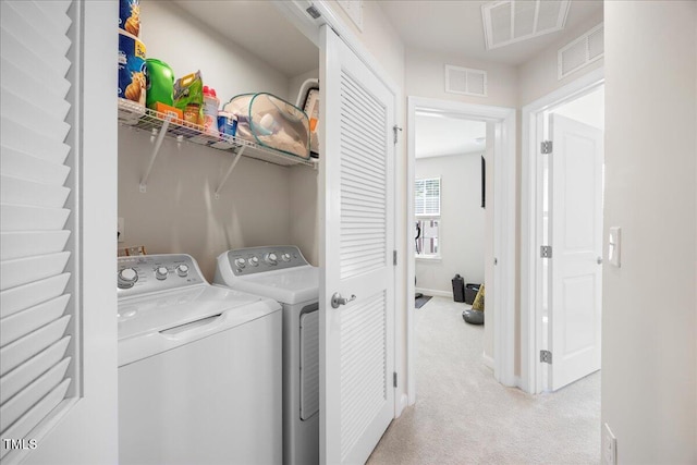 926 Romeria Dr, Durham, NC 27713 - clothes washing area featuring washer and clothes dryer, light carpet, and baseboards