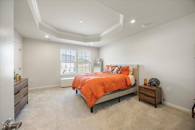 926 Romeria Dr, Durham, NC 27713 - bedroom featuring ornamental molding, a tray ceiling, recessed lighting, light carpet, and baseboards