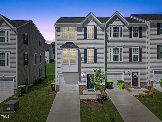 926 Romeria Dr, Durham, NC 27713 - view of property with driveway, an attached garage, and a lawn