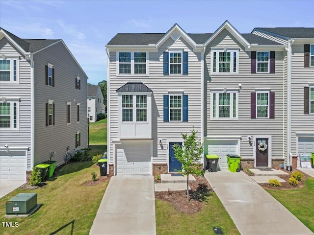 926 Romeria Dr, Durham, NC 27713 - townhome / multi-family property featuring driveway, an attached garage, and a front lawn