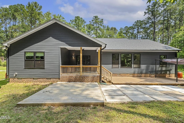 13417 New Light Rd, Raleigh, NC 27614 - view of front facade with crawl space, a deck, a front lawn, and roof with shingles