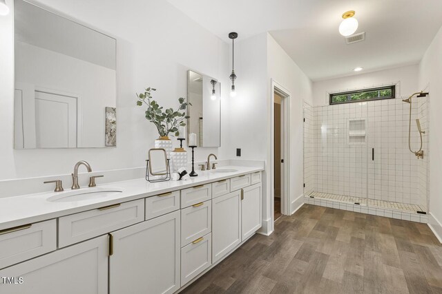 13417 New Light Rd, Raleigh, NC 27614 - full bath featuring a stall shower, double vanity, and wood finished floors