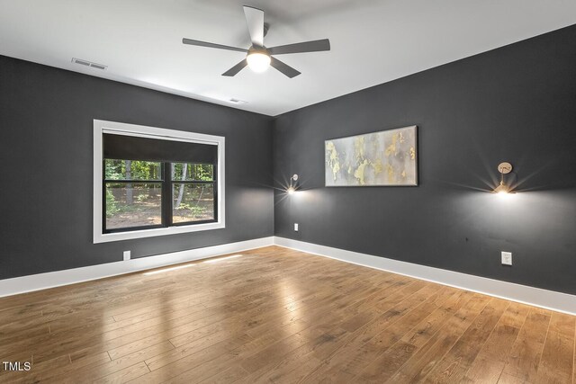 13417 New Light Rd, Raleigh, NC 27614 - unfurnished room featuring ceiling fan and hardwood / wood-style floors