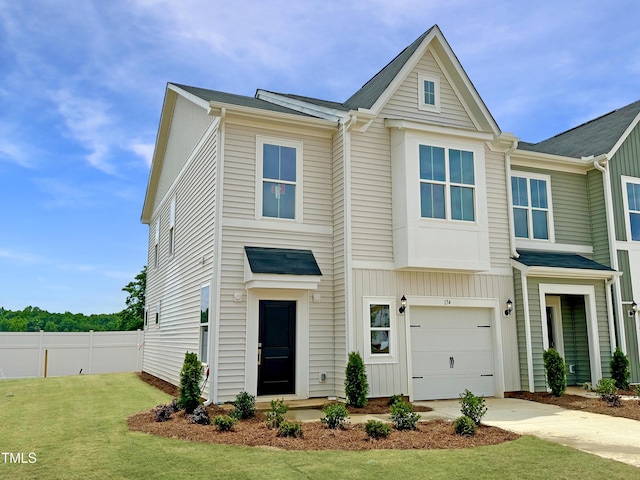 174 Ripple Way Unit 324, Clayton, NC 27520 - view of property featuring driveway and a garage